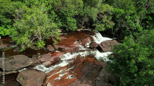 Waterfall amidst lush green forest, a stunning natural landscape Phu Quoc Vietnam Khu du lich sinh thai Suoi Da Ban photo