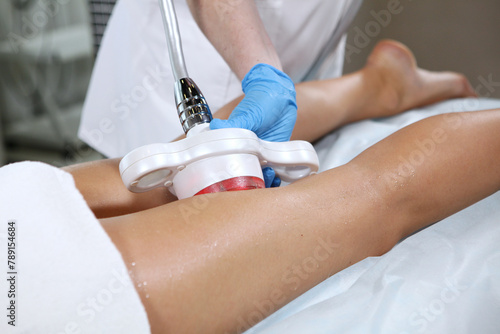 Anti-cellulite therapy in a beauty salon. Correction of the figure. Body care. Hardware cosmetology. Ultrasound correction of the body.