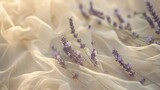 Multiple lavender sprigs are carefully arranged on a wavy cream tulle fabric, creating a gentle and soothing backdrop.