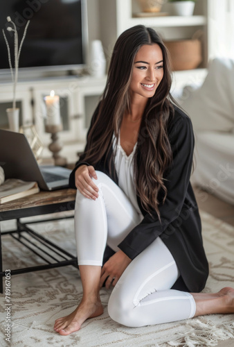 Woman Sitting on Floor Using Laptop