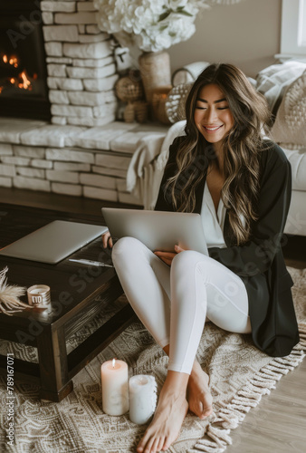 Woman Sitting on Floor Using Laptop