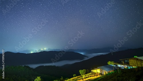 Night camping on homestay in the nature,timelapse stars and Milky way on the mountain and sea of fog.