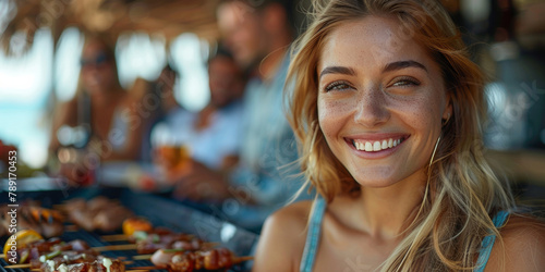 At a beach barbecue party, a cheerful blonde woman shares a fresh meal with friends.
