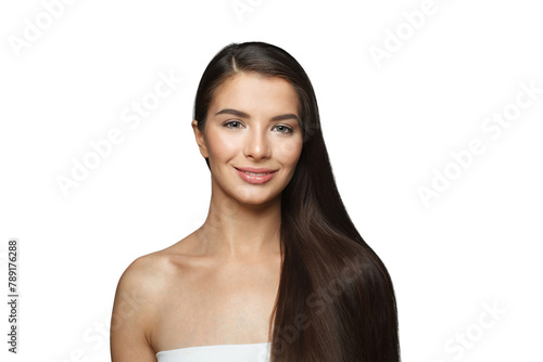 Isolated young female model with healthy hair, makeup and shiny clear skin posing against gray studio wall background. Facial treatment, cosmetology, hair care and beauty woman concept