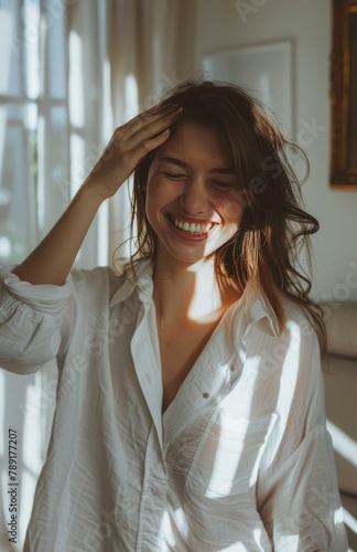 Woman Smiling and Holding Hair