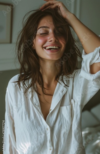Woman Smiling and Holding Hair