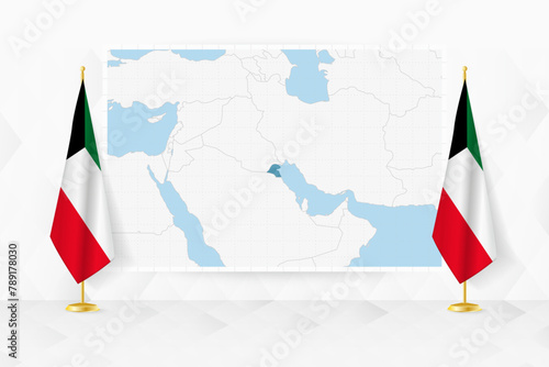 Map of Kuwait and flags of Kuwait on flag stand.