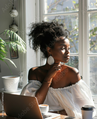 Woman Sitting in Front of Laptop Computer