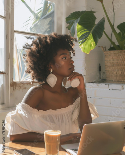 Woman Sitting in Front of Laptop Computer