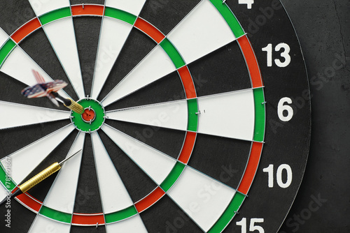 Darts. The dart for playing in the game board is stuck. Hit the sector in darts. The concept of a successful strategy.