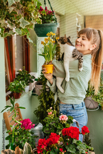 Woman Gardener with Cat in her Arms in Terrace Garden (ID: 789193882)