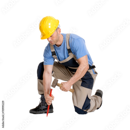 Worker constructor hammering golding metal chisel isolated on transparent layered background.