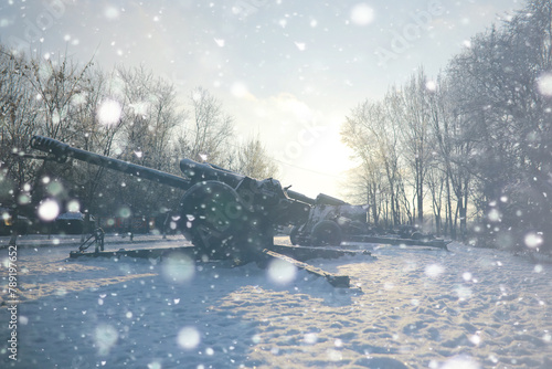 Military tank in a row. Battle tank in the snow on the roadside of highway. War in Ukraine in winter. photo