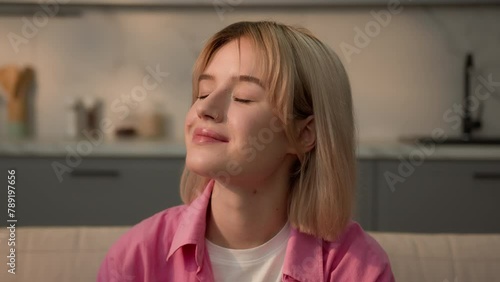 Dreamy inspired happy smiling calm peaceful dreaming relaxing Caucasian teen student girl woman lady female homeowner renter home apartment enjoy air conditioner dream eyes closed smell mental health