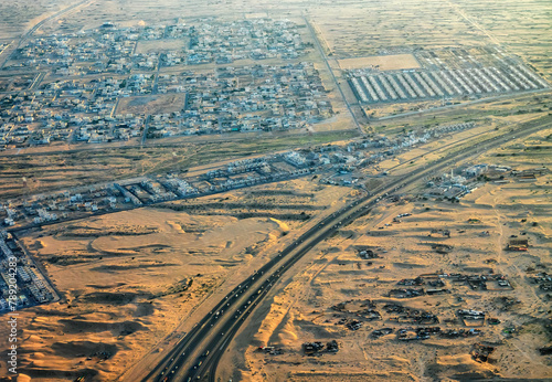 Dubai, condominium on the outskirts of the city, ground roads through the sands. View from above. Sand desert, arid climate of hot deserts