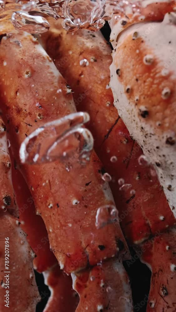 Cooking Northern Giant Crab Limbs. Close-up. Slow motion. Vertical video Cooking Northern Giant Crab Limbs. Close-up. Slow motion. Vertical video