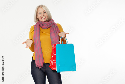 Shopper. Shopaholic shopping woman holding many shopping bags excited isolated on white. photo