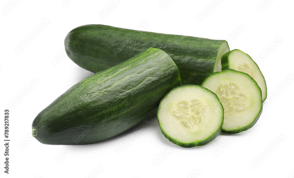Halves and slices of long cucumber isolated on white Halves and slices of long cucumber isolated on white