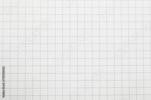 Checkered notebook sheet as background, top view