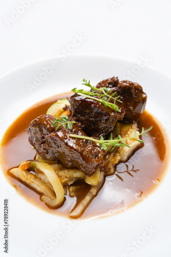Pork cheeks with Pedro Ximenez reduction and vegetables photo