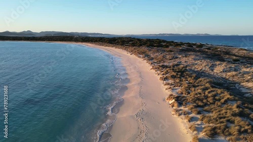 Espalmador beach, Formentera, at sunset. Ibiza and Es Vedra in the background.