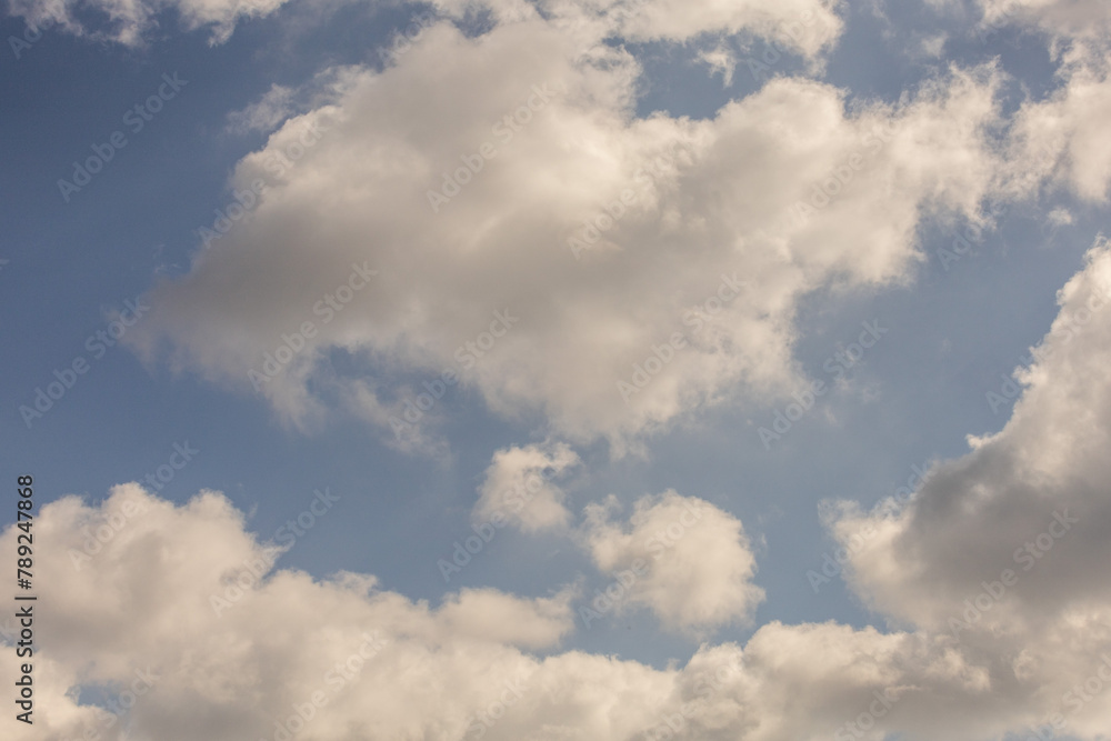 The sky is filled with clouds, and the sun is shining through them The sky is filled with clouds, and the sun is shining through them
