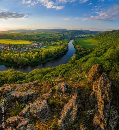 Spring sunset over meander of river Hron in Slovakia from extinct volcano, biotope of rare plants and flowers. Krivin, Hronsky Benadik. Discover the spring beauty of the mountains and rivers. photo