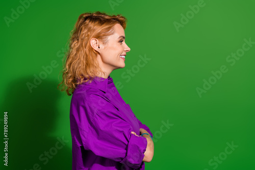 Photo portrait of lovely young lady profile crossed hands confident dressed stylish violet clothes isolated on green color background