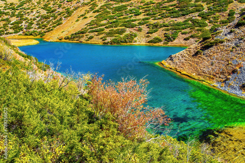 Mountain lake Koksay in the Aksu-Zhabagly Nature Reserve. Lake Koksay located in the Tien Shan mountains in the southern Kazakhstan. Aksu-Zhabagly is the oldest nature reserve in Central Asia