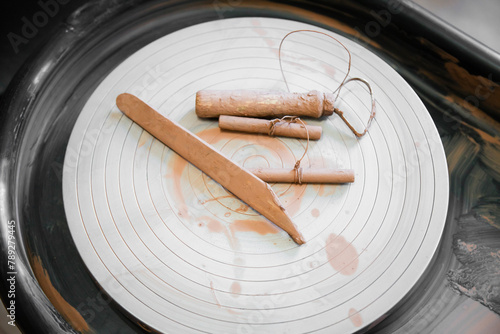 pottery, workshop, ceramics art concept . Close up view of string cutter and pottery tools