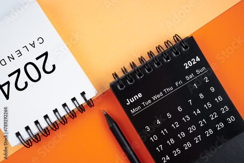 June 2024 desk calendar black and white color with pencil.