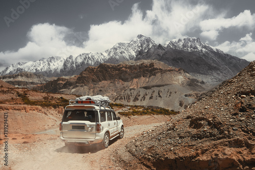 Off-road travel on extreme high mountain road in Upper Mustang, Nepal. Nice view of the Himalaya Mountains. © soft_light
