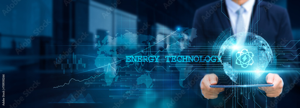 Energy Technology, Businessman use tablet and integrate innovative solutions with the structure of smart grids on the network for futuristic energy, sustainability, and infrastructure development. Energy Technology, Businessman use tablet and integrate innovative solutions with the structure of smart grids on the network for futuristic energy, sustainability, and infrastructure development.