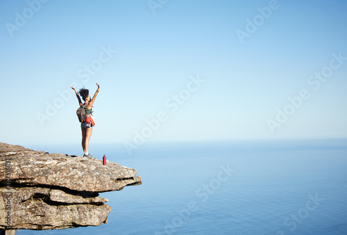 Woman, success and open arms on mountain cliff for freedom, achievement and explore in nature. Hiking, exercise and wellness with ocean, view and cardio for female hiker in for adventure on mockup