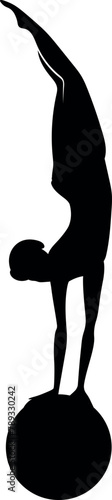 Silhouette of gymnast on ball