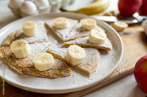 Oatmeal pancake with fresh bananas for healthy breakfast on a plate