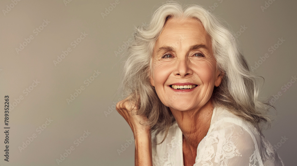 Against a simple backdrop, an elderly woman exudes confidence and vitality, her radiant smile capturing the essence of ageless allure in a captivating cosmetics ad-style portrait.