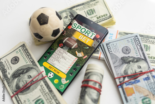 tablet pc with app for sport bets, on top of stacks of banknotes, white background, concept of online bets 3d render