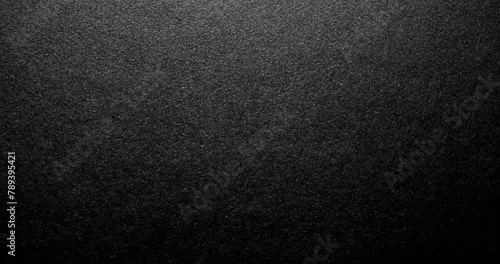 Black rough paper surface, slow moving. Use for background and texture. photo