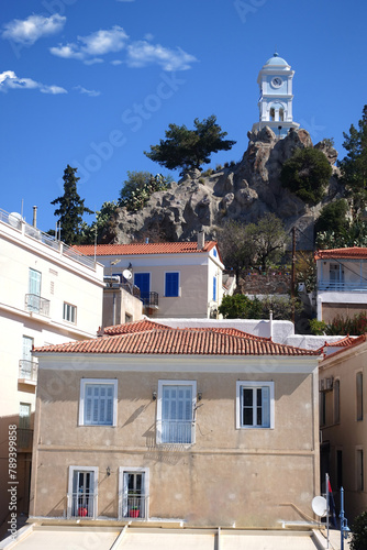 Famous main picturesque village of Poros island featuring clock tower, Saronic Gulf, Greece photo