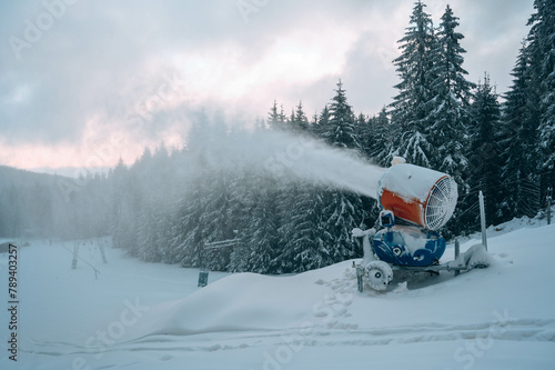 Snow cannon in winter mountains.