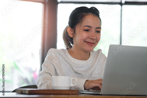 Businesswoman or student using laptop for searching, working, online learning, marketing, freelance, studying, distance education network online technology background. 