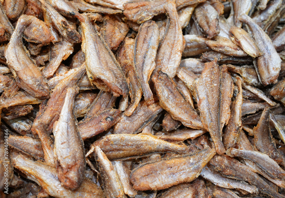 fried small fish as food background fried small fish as food background