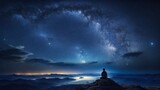 Person finds solitude atop rocky peak, surrounded by serene beauty of nature under celestial dance of starry night. Milky way, like artists brush, paints ethereal arc across sky.