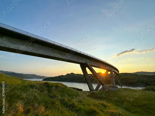 Sunset under the curve of the Kylesku Bridge, Scotland photo