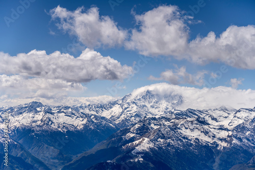 Fototapeta Naklejka Na Ścianę i Meble -  Rosa peak looms out of stau clouds, Italy