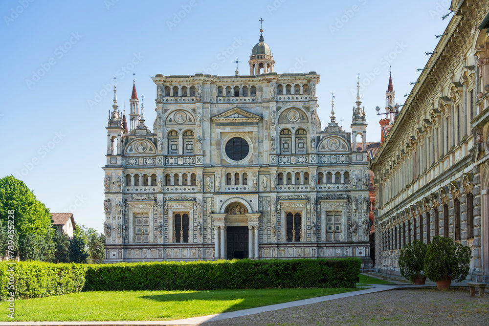 Fototapeta premium Certosa di Pavia monastery, historical monumental complex that includes a monastery and a sanctuary. green court and a church.The Ducale Palace on the right,Pavia,Italy.