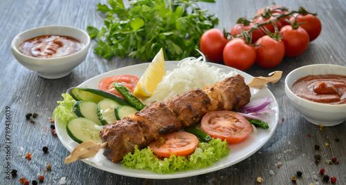 grilled chicken with vegetables . kebab food dish on table