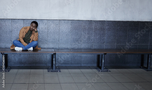 Woman, sad and tired with depression in subway for bad memory, grief and lonely on travel. African girl, person and mental health at train station for anxiety, lost and stress for future in New York