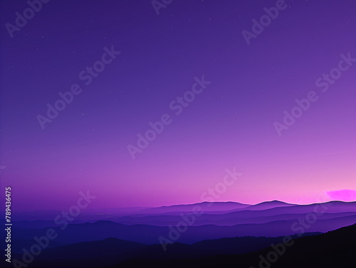 Twilight descends over a layered mountain landscape under a star-speckled purple sky.